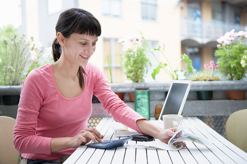 Young woman working on finances